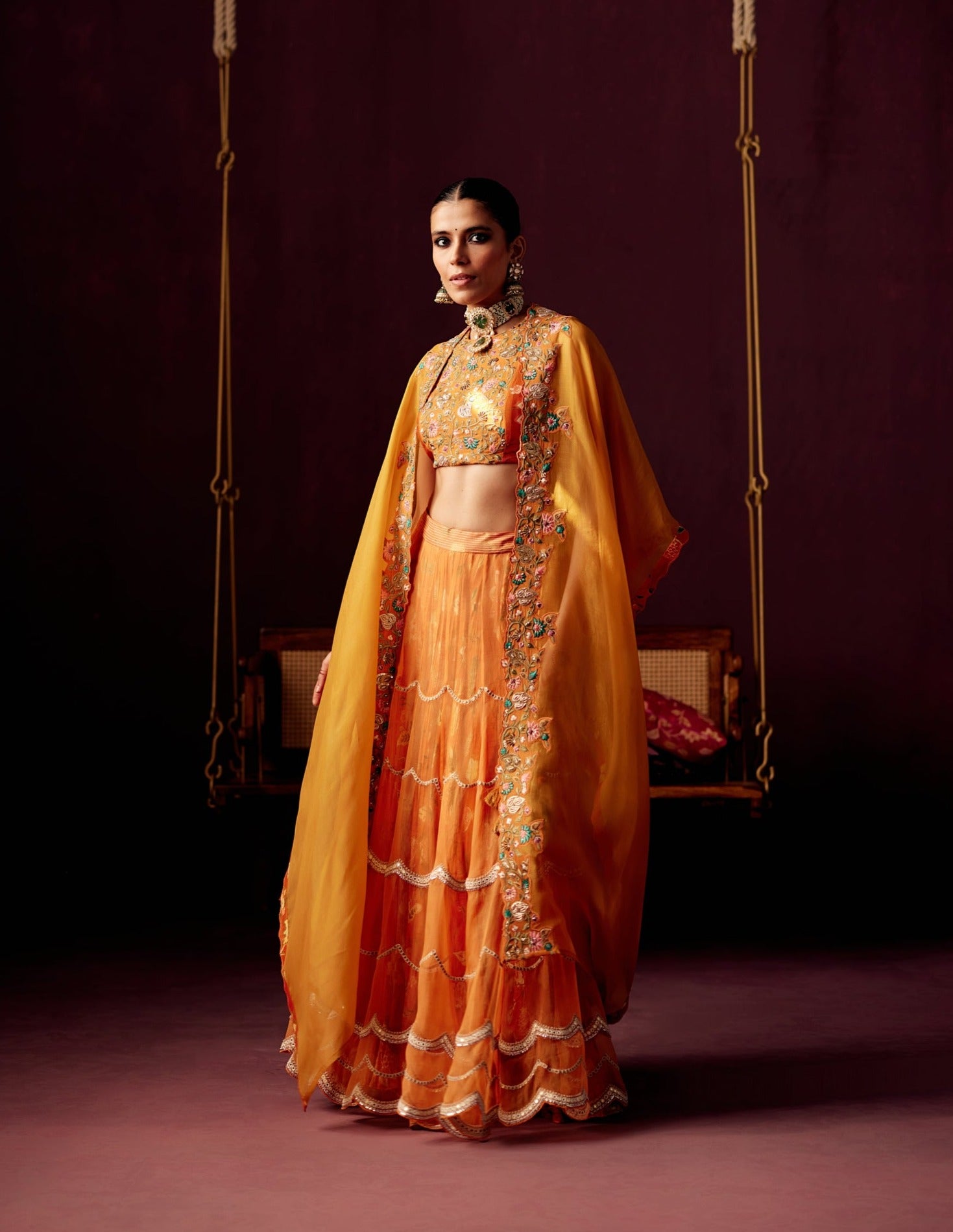 Burnt Orange Layered Lehenga with Bustier & Drape Cape