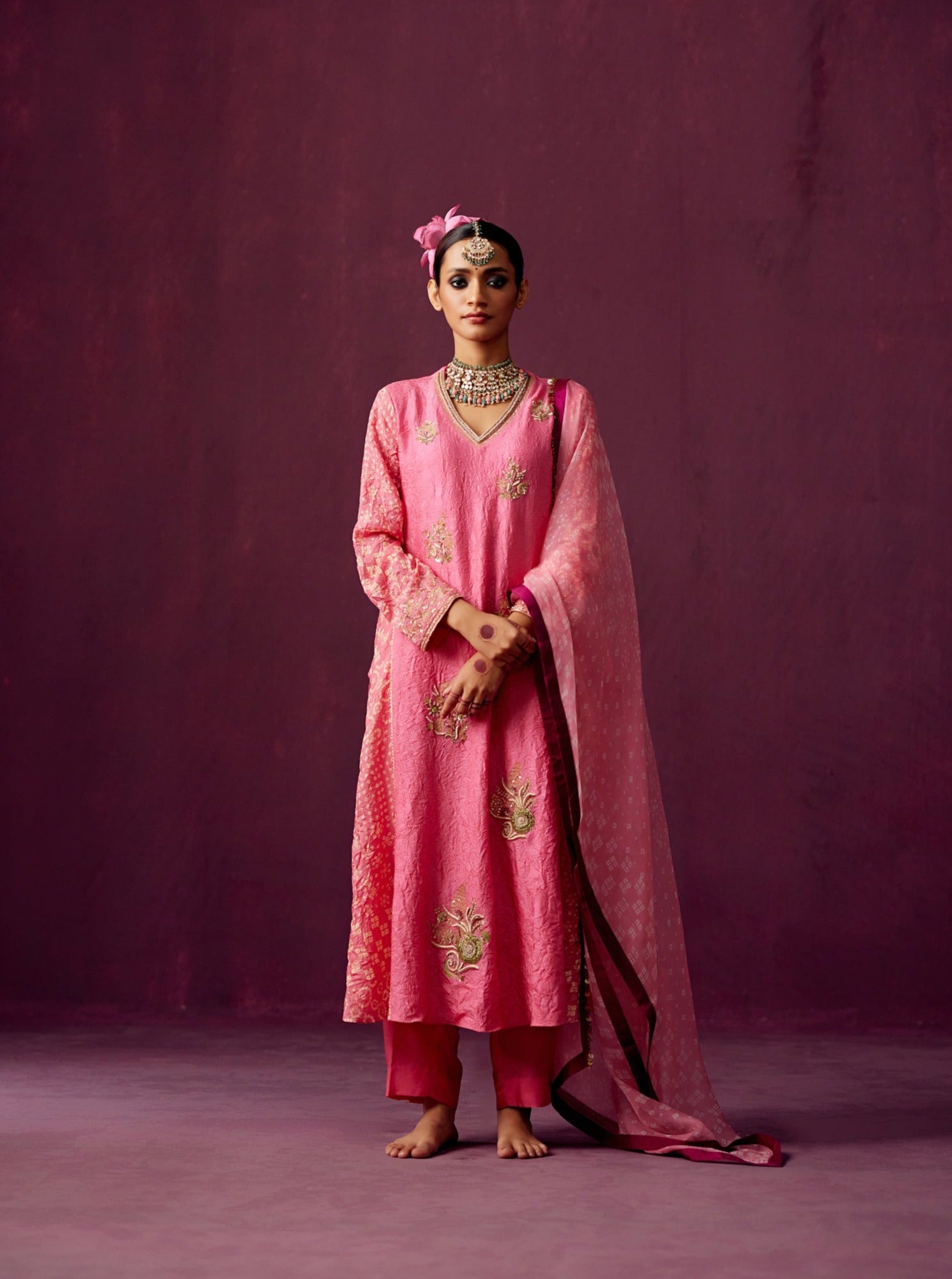 Pink kurta with Bandhej side panels, silk pant and bandhej print organza dupatta.